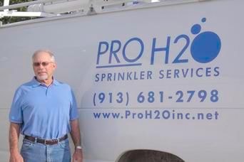 Pro H2O owner standing next to company vehicle